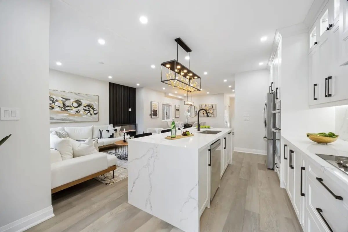 Open-concept kitchen with a new island after a wall came out, the kind of scope a permit application description has to spell out section by section