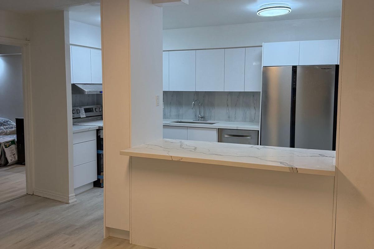 Renovated condo kitchen in Scarborough after a wall removal and electrical work, the kind of job whose renovation inspection stages end with a final inspection