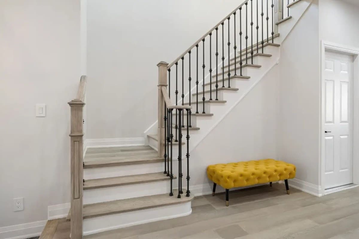 Interior staircase in a house, where exits for a secondary suite in Markham are planned